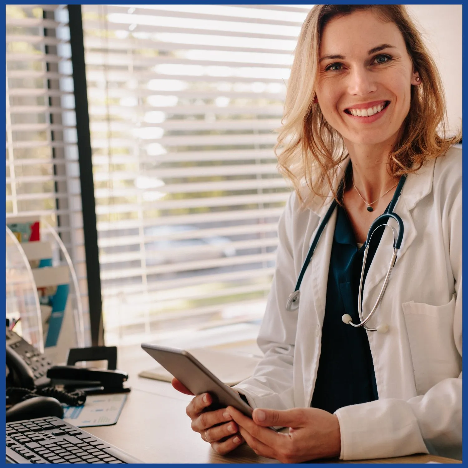 Primary care physician smiling in her local office