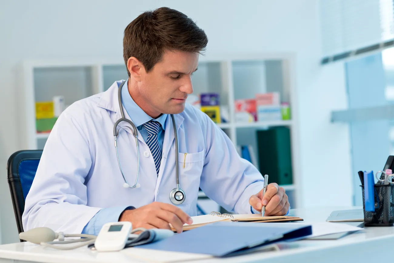 Physician at work on laptop