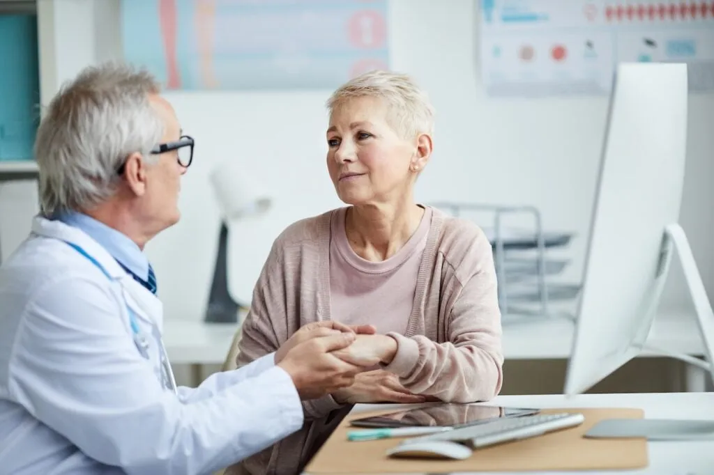Senior Doctor with Patient