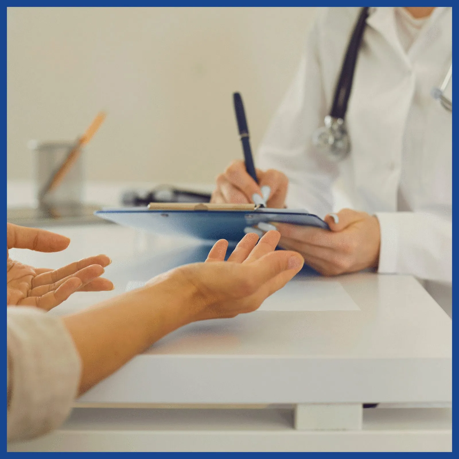 Doctor taking notes with a patient at a TM Flow System follow-up visit