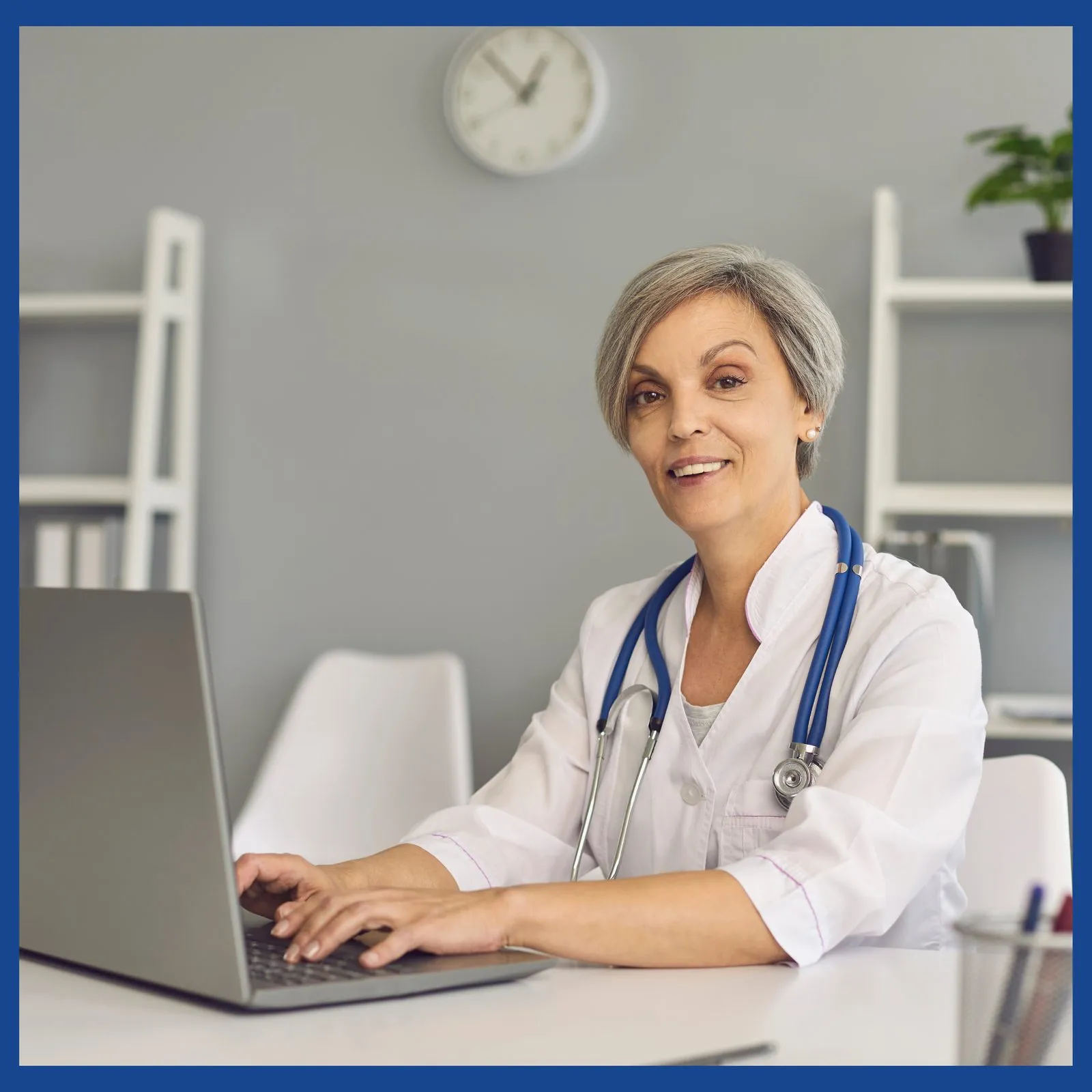 Doctor on a laptop reviewing TM Flow System results