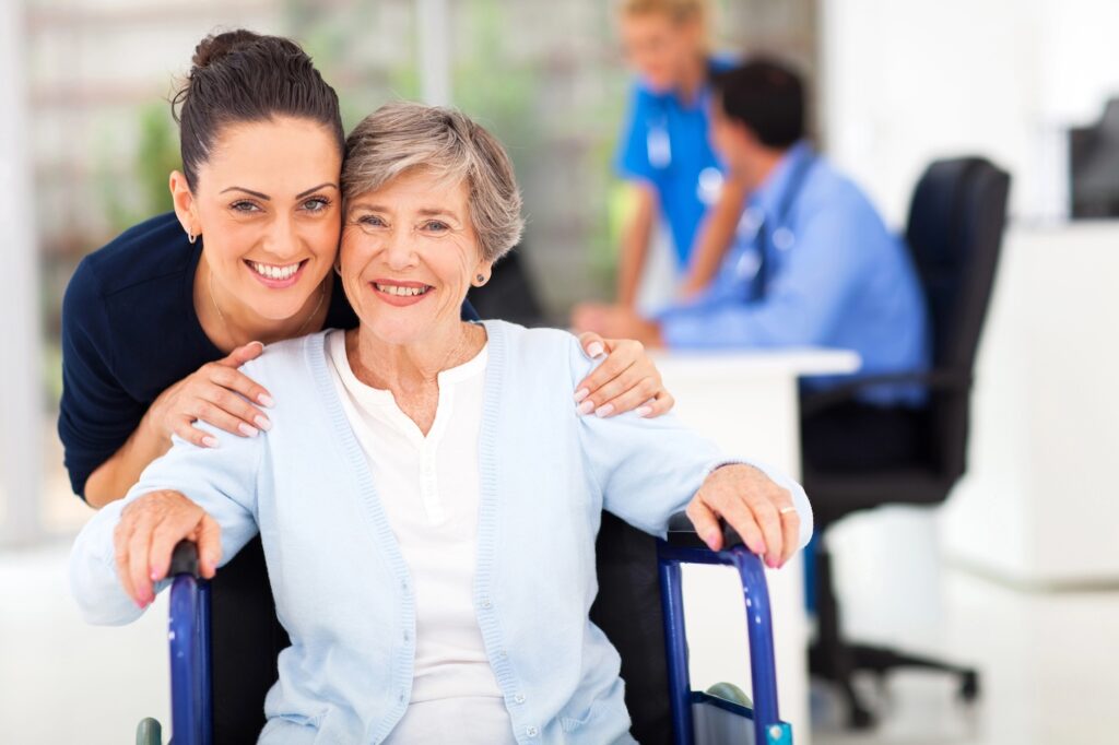 Female doctor with patient in wheelchair