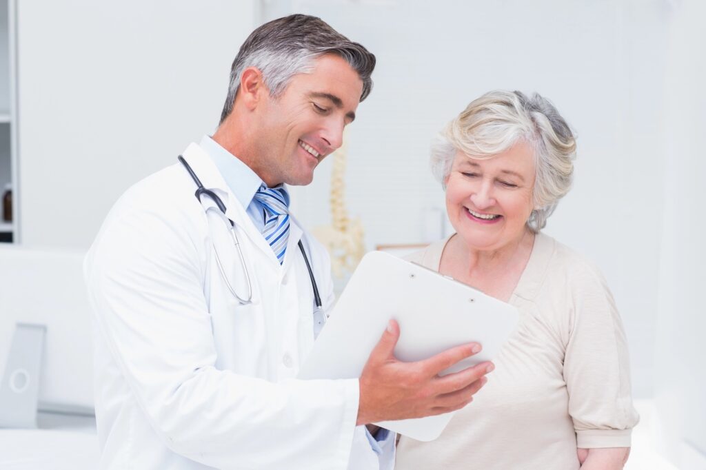 doctor sharing good news with happy patient