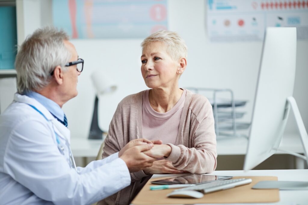 Senior Doctor with Patient