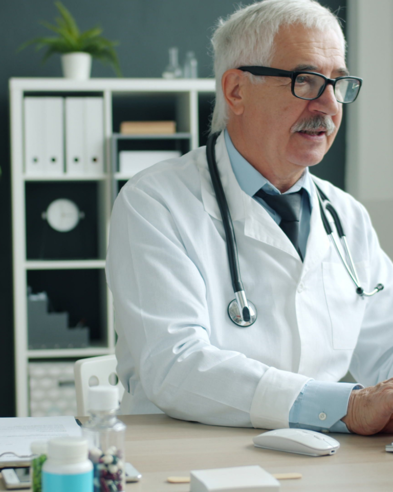 Seasoned medical professional looking over his notes
